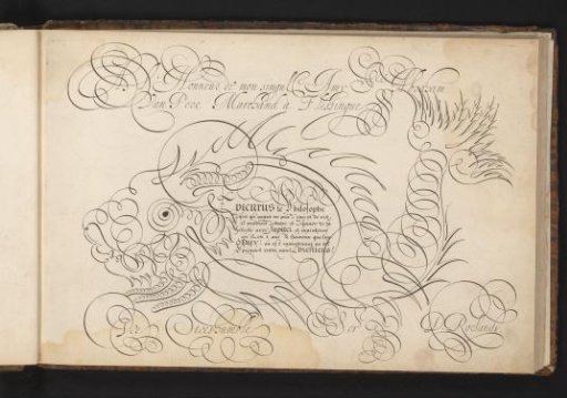 Writing sample with a large fish in scrollwork