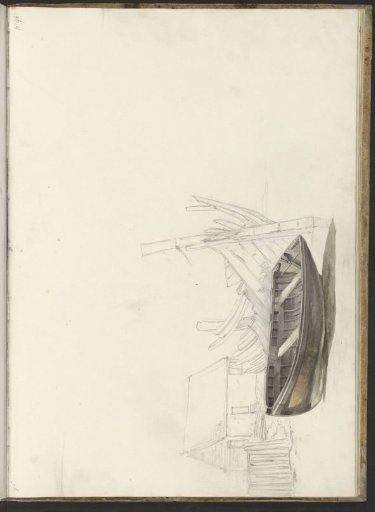 Boat and a wreck of a boat on a farmyard
