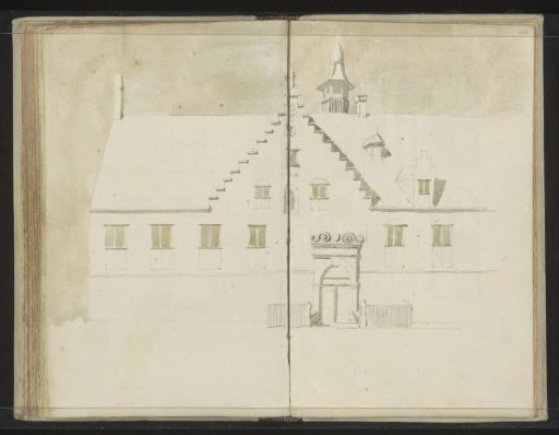 Facade of a detached building with a tower and stepped gable
