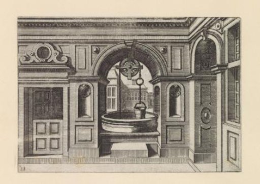 Well in an arched opening in a wall