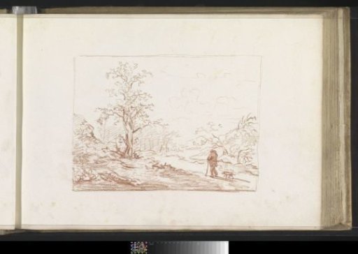 Man with a walking stick and dog on a path