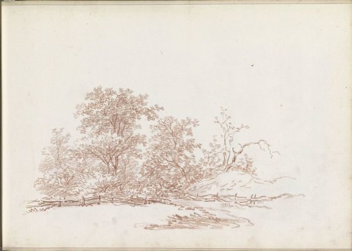 Enclosed meadow next to a group of trees