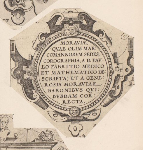 Round cartouche with two mascarons