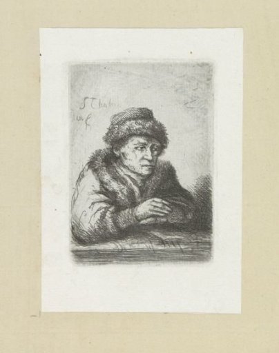 Adult man at a table, in a fur coat
