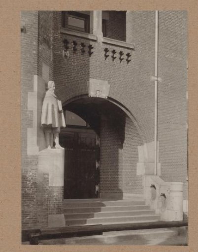 Sculpture of Hugo de Groot at the entrance at the Damrak of the Beurs van Berlage in Amsterdam