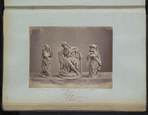 Three sculptures of religious figures with Saint Jesse of Bethlehem in the center