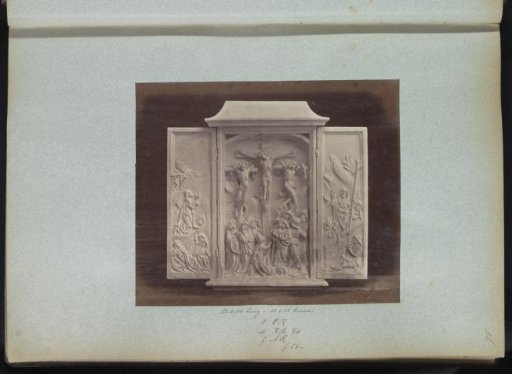 Plaster cast of a triptych sculpture with a crucifixion scene