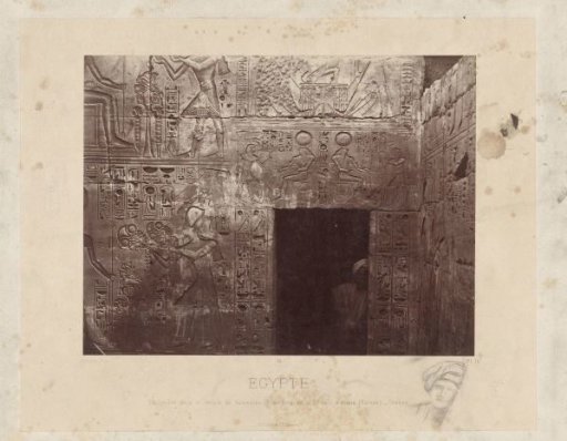 Man in a doorway in the temple of Ramses III in Egypt
