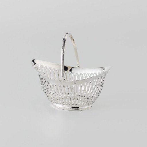 Silver bonbon basket, boat-shaped with pierced rim.