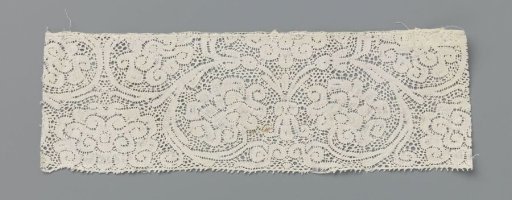 Strip of bobbin lace with tendrils curling into circles with peonies