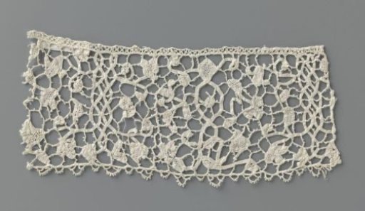 Strip of mixed lace with flowers between vertically hanging ribbons