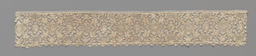 Strip of bobbin lace with diamonds and ovals