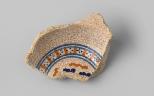 Fragment of a plate with a white-firing sherd, with white glaze on the front and back, decorated on the front with stripes and dots in orange, light and dark blue