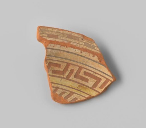 Fragment of a plate with a red-firing sherd, featuring stripes on the front in sgraffito technique with white and yellow glaze