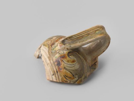 Fragment (foot) with reddish sherd, with handle, decorated on the front with floral forms and bands in sgraffito technique with brown, green and beige glaze