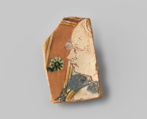 Fragment (foot) of a large dish with red sherd, in sgraffito technique a woman's bust turned to the left, with panels enclosed by ochre-coloured lines as background, in blue, orange, brown, with a green flower; on the underside a red dot is left free at the base