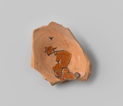 Fragment (foot) with red sherd; letters resembling ϮS (or reversed) scratched in the base, brown hazel-like glaze that is flaking heavily