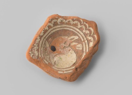 Fragment (foot) with red sherd, on the inside in a double circle in white slip a sitting rabbit