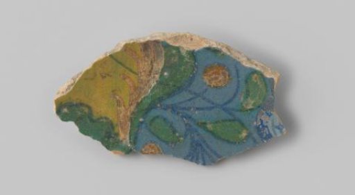 Sherd of white-fired earthenware, decorated on the front with leaves in green and yellow glaze on a blue background, glazed in blue on the back