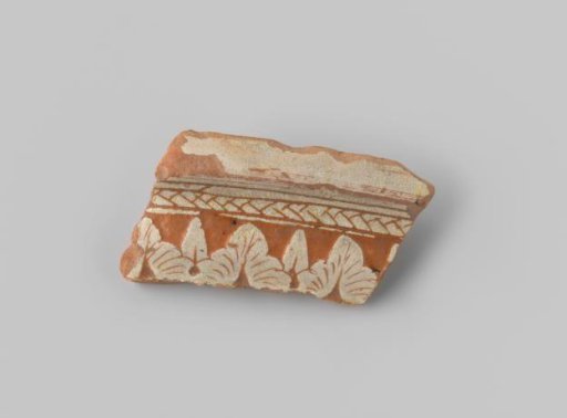 Fragment with red sherd, on the exterior provided with a leaf border and striped border in white glaze on a terracotta background