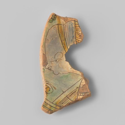Fragment (foot) of a large dish with red sherd, in sgraffito technique a woman's bust turned to the left, caricature with exaggerated high forehead, in ochre, blue and green
