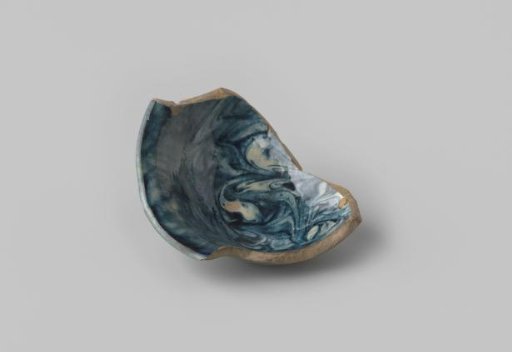 Fragment of a foot and rim of a small bowl with grey sherd and blue and white marbled glaze