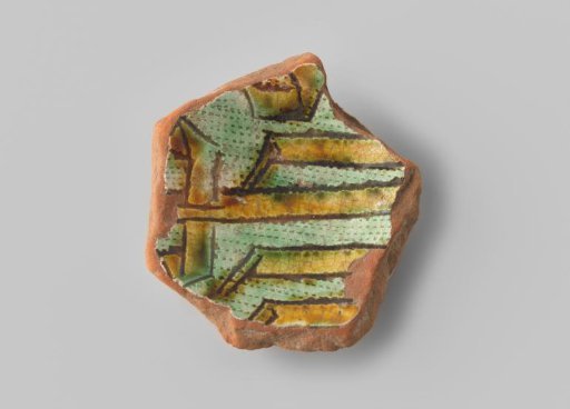 Fragment (foot) with red sherd; in sgraffito technique, a Jesus monogram in ochre on a green, vertically dotted ground