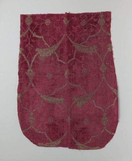 Fragment of red velvet brocade with vine motif