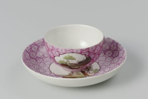 Cup and saucer with a multicoloured landscape in a medallion cut out in a geometric pattern