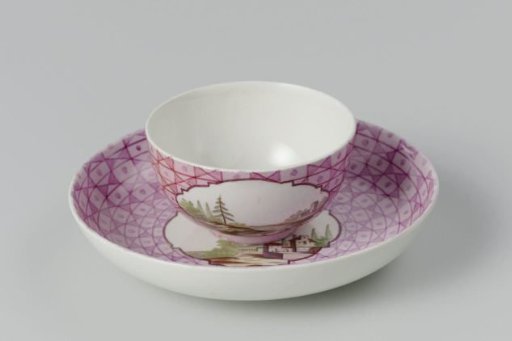 Cup and saucer with a multicoloured landscape in a medallion cut out in a geometric pattern