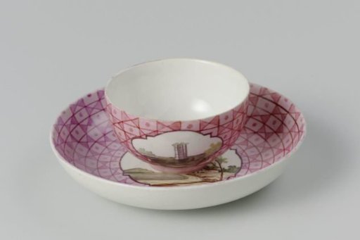 Cup and saucer with a multicoloured landscape in a medallion cut out in a geometric pattern