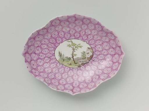 Pattipan with a multicoloured landscape in a medallion cut out in a geometric pattern