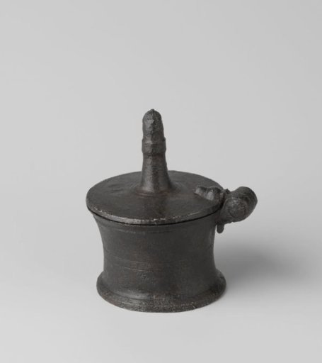 Tin salt cellar with insignia on the bottom