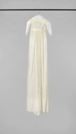 A baptismal dress of fine batiste, consisting of a long skirt of two panels, gathered at the short bodice with sleeves set.