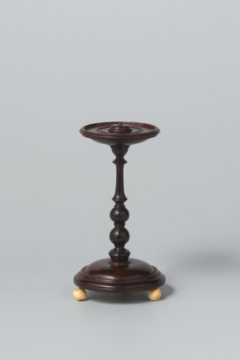 Gueridon of rosewood on ivory legs