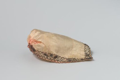 Cradle cover, made of soft pink silk, trimmed with gold lace