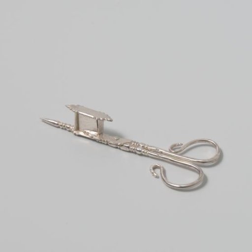 Silver snuffer