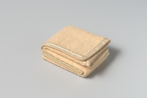 Blanket of white wool, trimmed with blue silk ribbon