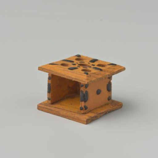 Stove, yellow in color, decorated with black dots