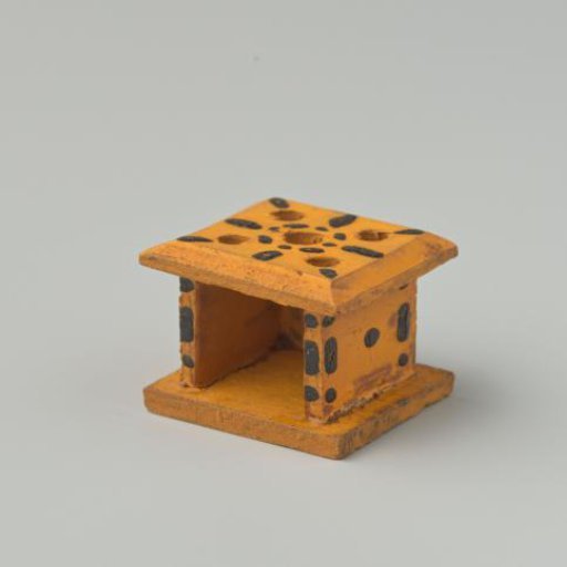 Stove, yellow in color, decorated with black dots