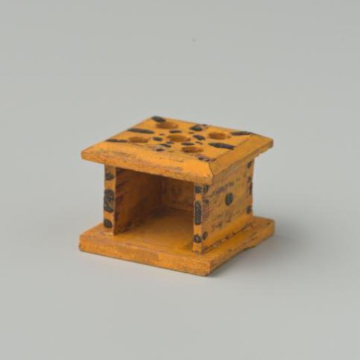 Stove, yellow in color, decorated with black dots