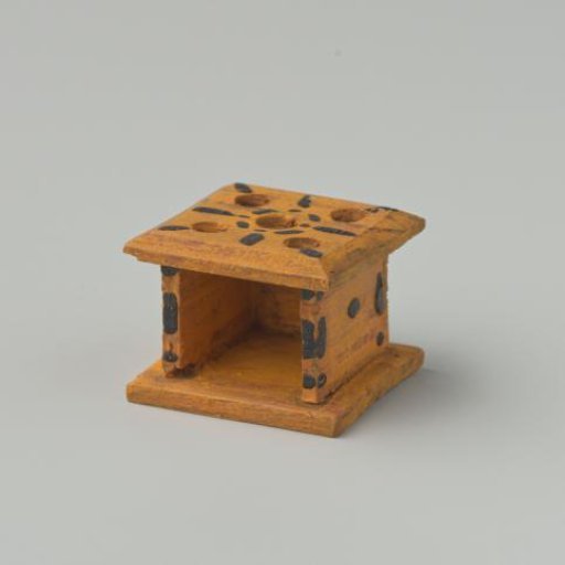 Stove, yellow in color, decorated with black dots