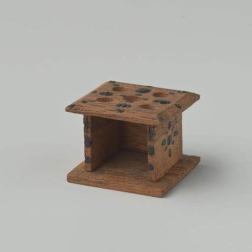 Stove of walnut wood, decorated with black dots
