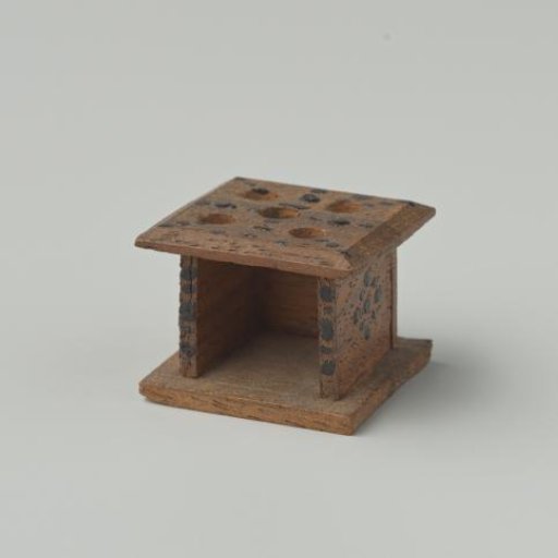 Stove of walnut wood, decorated with black dots