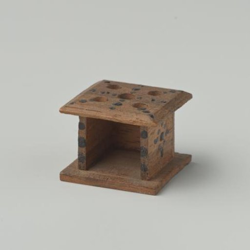 Stove of walnut wood, decorated with black dots