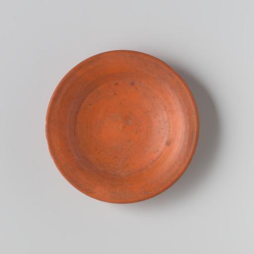 Plate of turned, red-painted wood