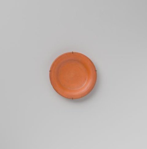 Plate of turned, red-painted wood