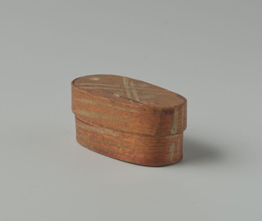 Box with a lid, red, decorated with white stripes and dots on the lid