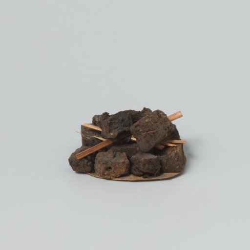 Peat blocks, stacked on a piece of paper