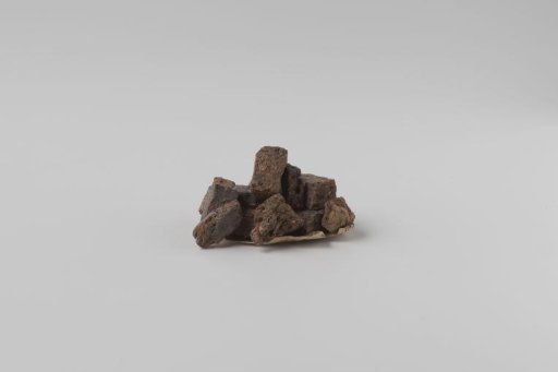 Peat blocks, stacked on a piece of paper
